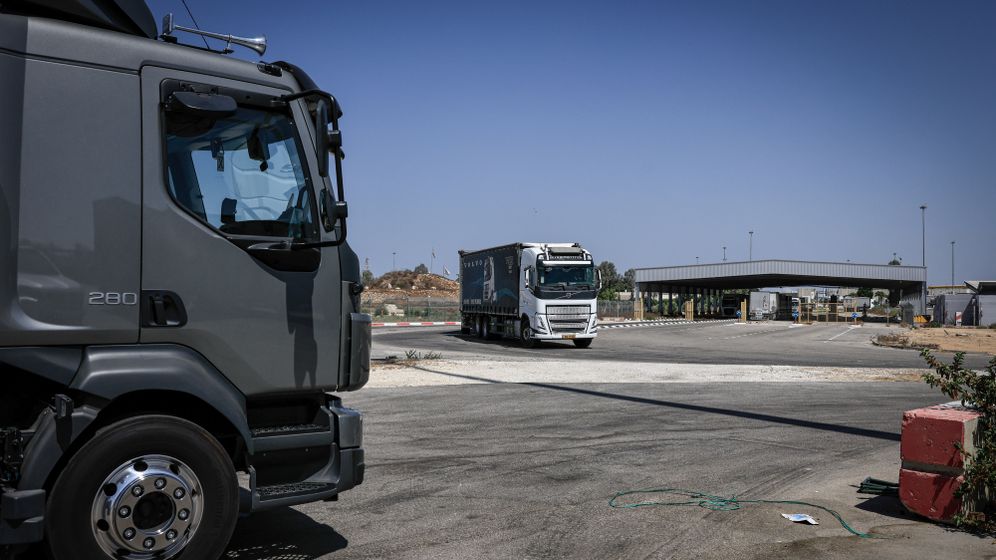 Tsafrir Abayov/Flash90 Trucks loaded with humanitarian aid wait at the Kerem Shalom crossing before entering the Gaza Strip from southern Israel. August 12, 2026