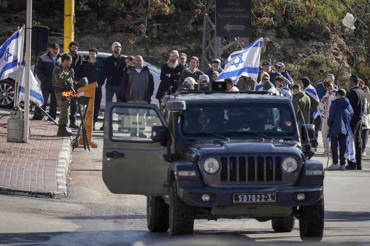 Israeli army close main roads and restricted Palestinian movement as Israeli settlers try to enter the Qizoun area east of Hebron December 10, 2025.