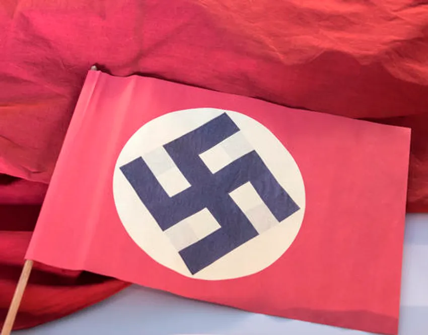 A swastika flag displayed in a showcase during the press preview at the new permanent exhibition of former Nazi concentration camp Buchenwald near Weimar, central Germany, Wednesday, April 13, 2016.