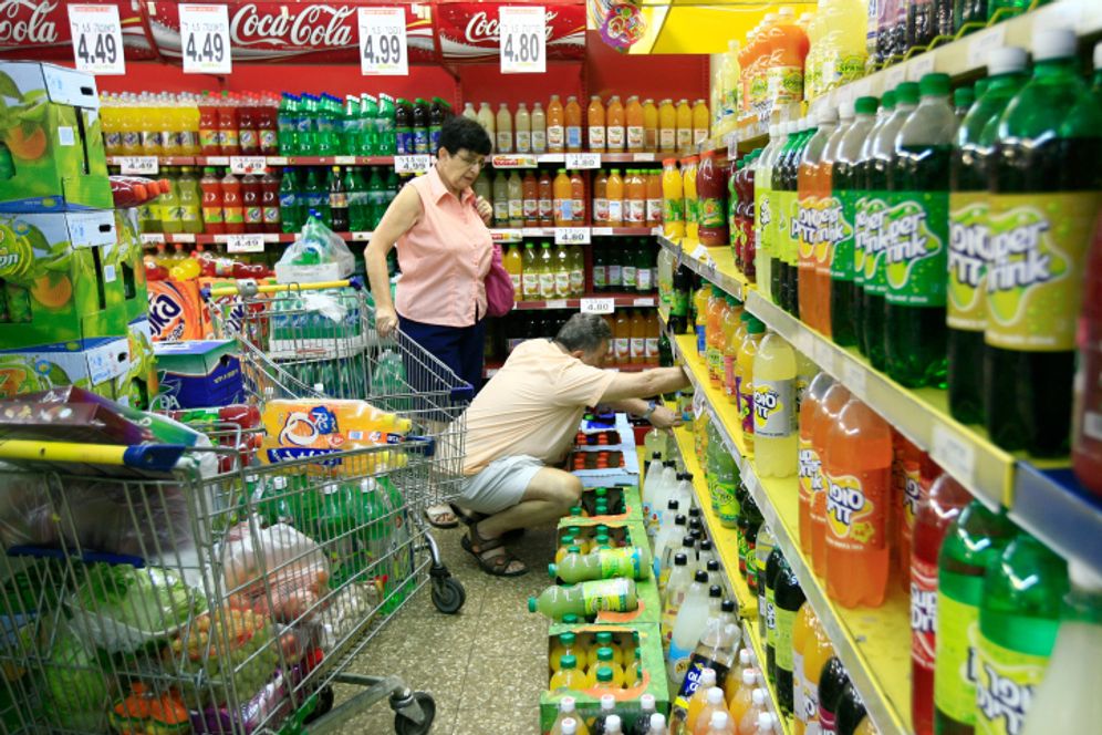 Shoppers purchase fizzy drinks in a supermarket in Jerusalem.