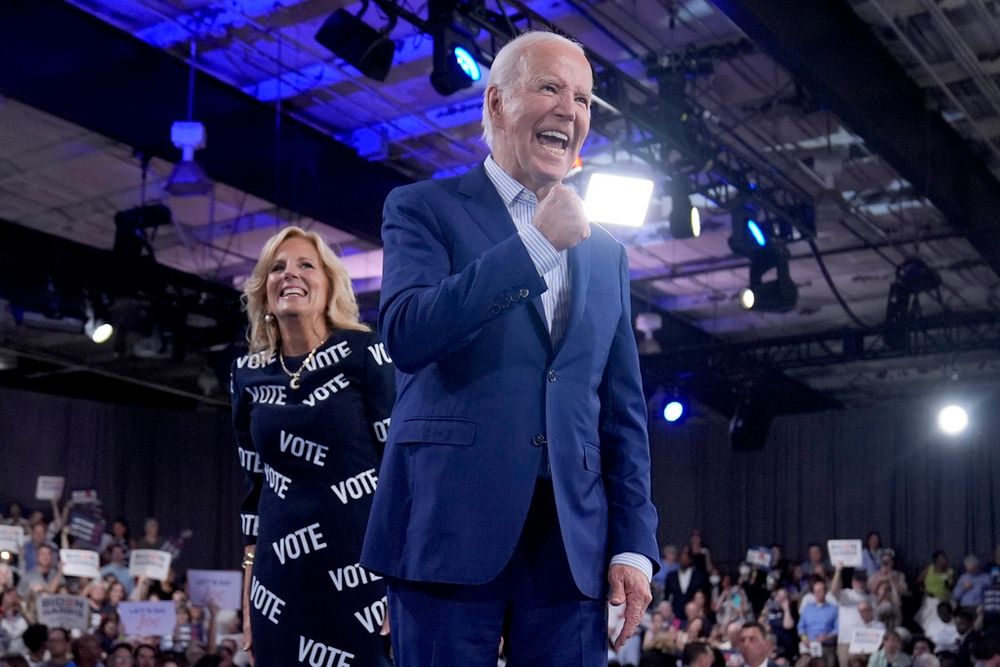 President Joe Biden and first lady Jill Biden walk off stage after speaking at a campaign rally, June 28, 2024.