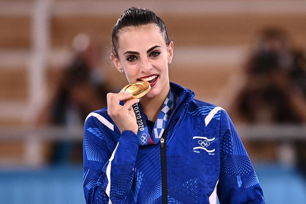 Israel's Linoy Ashram poses with her gold medal during the podium ceremony of the individual all-around final of the Rhythmic Gymnastics event during Tokyo 2020 Olympic Games at Ariake Gymnastics Center in Tokyo, on August 7, 2021.