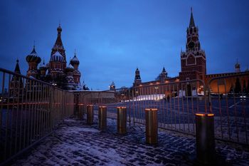 An almost empty Red Square with the St. Basil's Cathedral, left, the Kremlin Wall and the Spasskaya Tower, right, in the background are seen at dawn in Moscow, Russia, Jan. 30, 2024.
