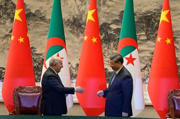 Chinese President Xi Jinping (R) shakes hands with Algerian President Abdelmadjid Tebboune in Beijing, China.