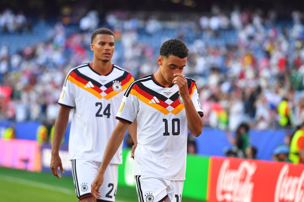Germany's Jamal Musiala (10) and Malick Thiaw (24) walk off the field after losing to Paraguay in a shootout during the World Cup round of 32 soccer match in Foxborough, Mass., near Boston, Monday, June 29, 2026.
