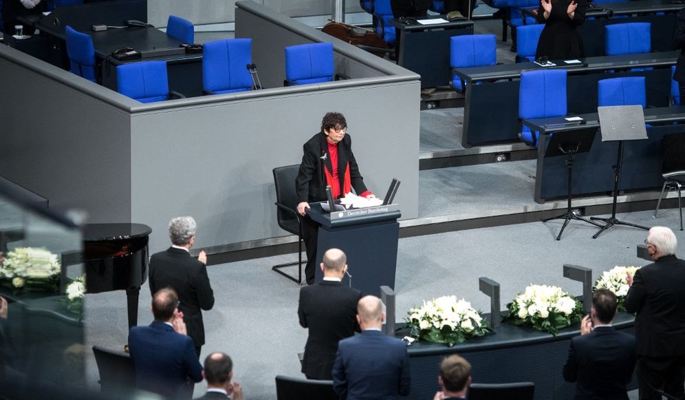 Holocaust survivor Inge Auerbacher (C) receives applause after delivering her speech during a commemoration ceremony at the plenary hall of the German Bundestag (lower house of parliament) on January 27, 2022, the International Holocaust Remembrance Day.