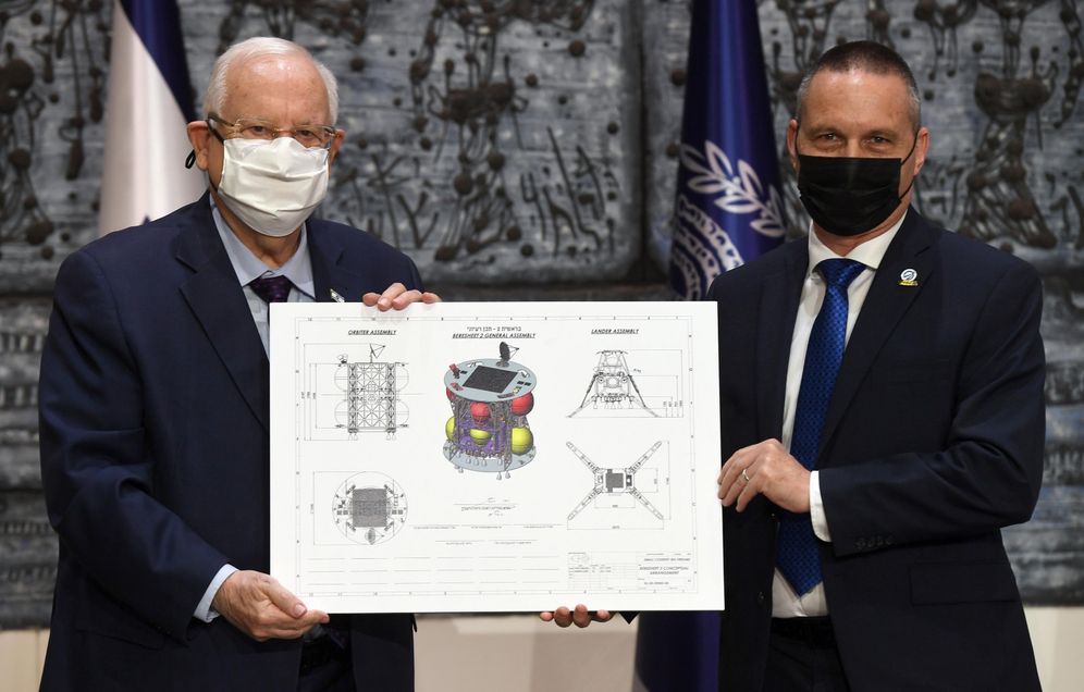 Israeli President Reuven Rivlin, left, hosts an event announcing the Beresheet 2 project, Israel's second spacecraft to be launched to the moon, at the President Residency in Jerusalem, on December 8, 2020.