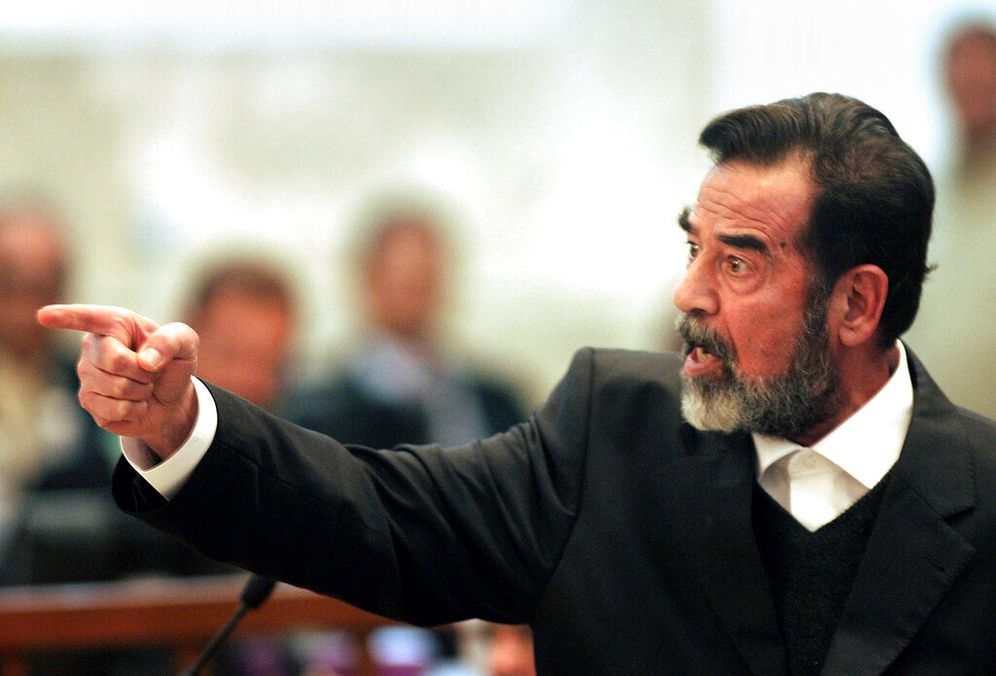 AP Photo/Darko Bandic, File صدام حسين - صورة ارشيفية