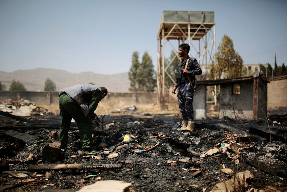 Yemeni police inspect a site of Saudi-led airstrikes targeting two houses in Sanaa, Yemen.