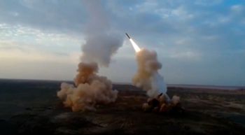 FILE - This video grab shows launching underground ballistic missiles by the Iranian Revolutionary Guard during a military exercise, on July 29, 2020.